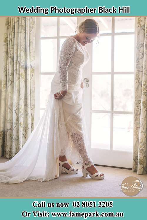 Photo of the Bride's looking at the shoes Black Hill