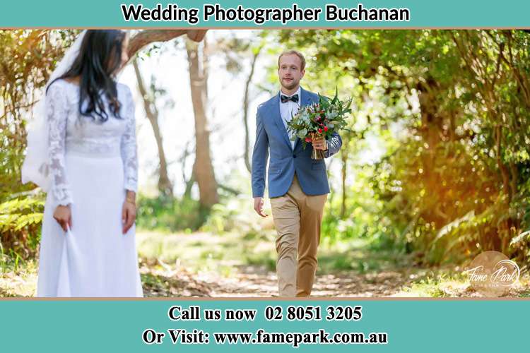 Photo of Groom bringing flower to the Bride Buchanan