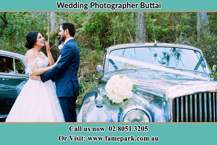 Photo of the Bride and the Groom outside the bridal car Buttai NSW 2323