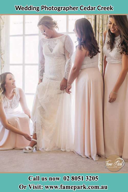 Photo of the Bride preparing with the Bride's Maid Cedar Creek