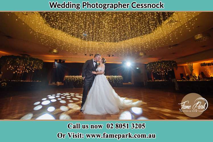 Photo of the Bride and Groom kissing at the dance floor Cessnock