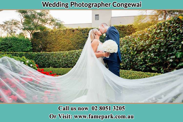 Photo of the Bride and the Groom kissing at the garden Congewai NSW 2325