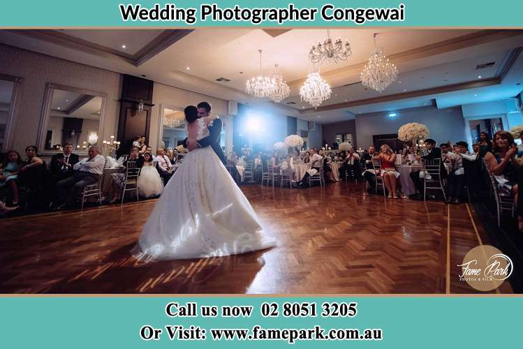 Photo of the Bride and the Groom hugging at the dance floor Congewai NSW 2325