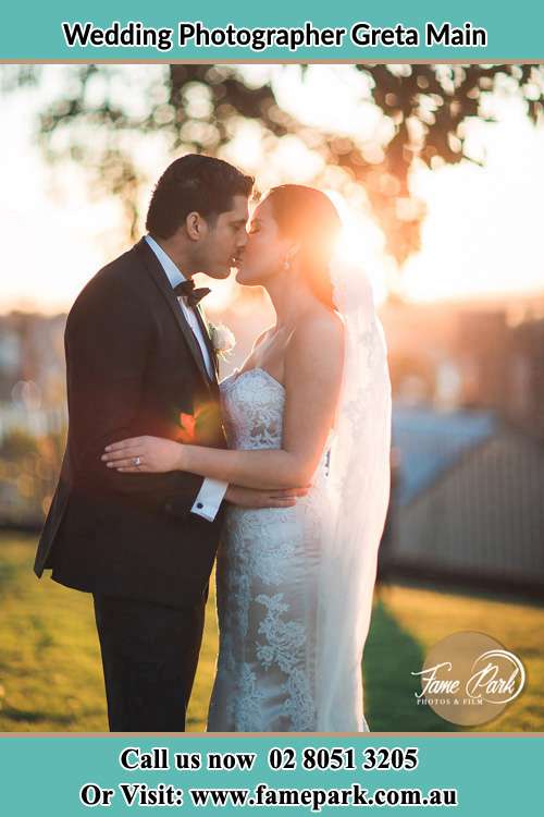 Photo of the Groom and the Bride kissing Greta Main NSW 2325