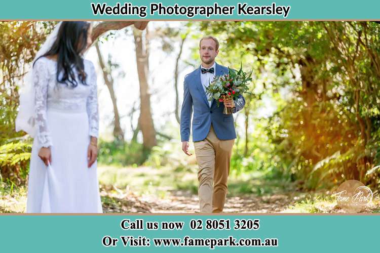 Photo of the Groom giving flower to his Bride Kearsley NSW 2325