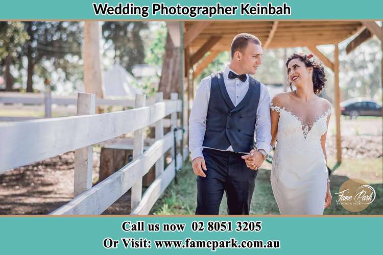 Photo of the Groom and the Bride looking each other while walking Keinbah NSW 2320