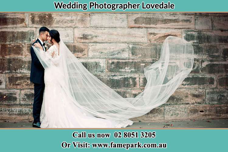 Bride and Groom near the wall Lovedale