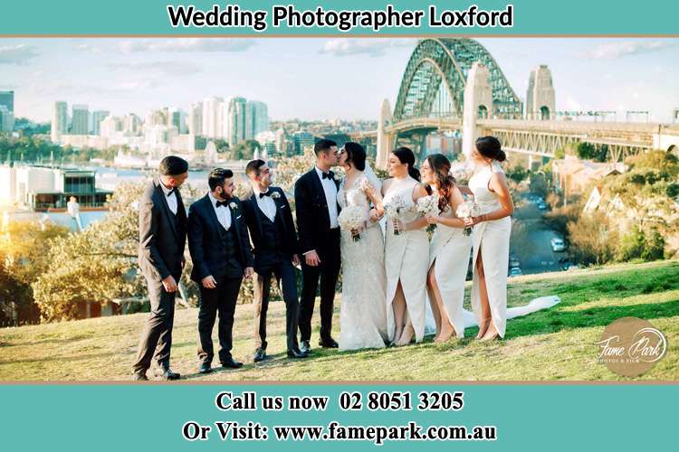 Bride and Groom together with secondary sponsors at the hill Loxford