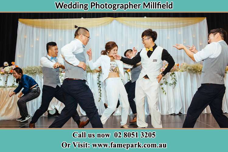 Photo of the Bride and the Groom dancing with the groomsmen Millfield NSW 2325