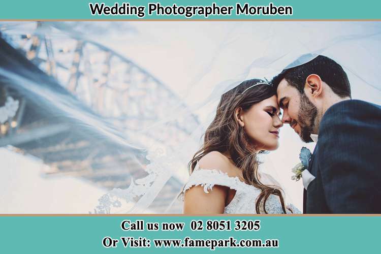 Close up photo of the Bride and the Groom under the bridge Moruben NSW 2325