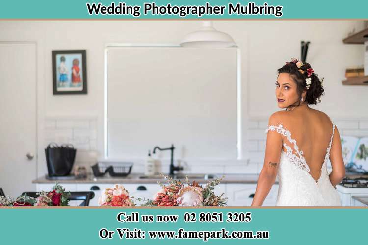 the Bride showing a pose on the camera Mulbring NSW 2323