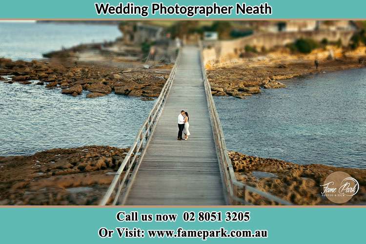 Bride and The Groom in the middle of the bridge Neath