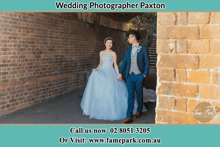 Bride and Groom Walking through the corner Paxton 