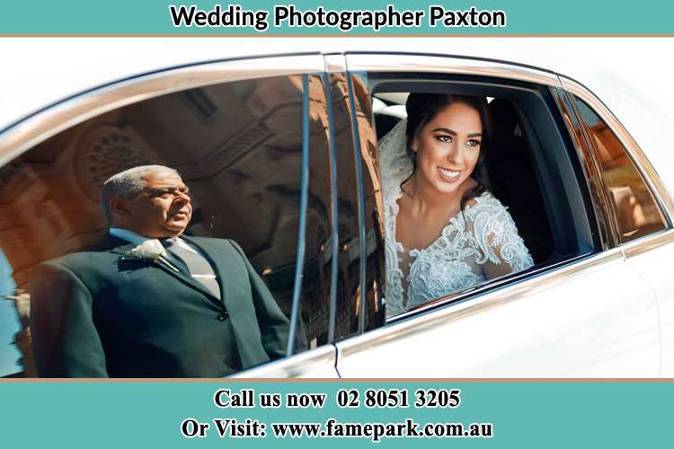 Photo of the Bride inside the bridal car with her father standing outside Paxton NSW 2325