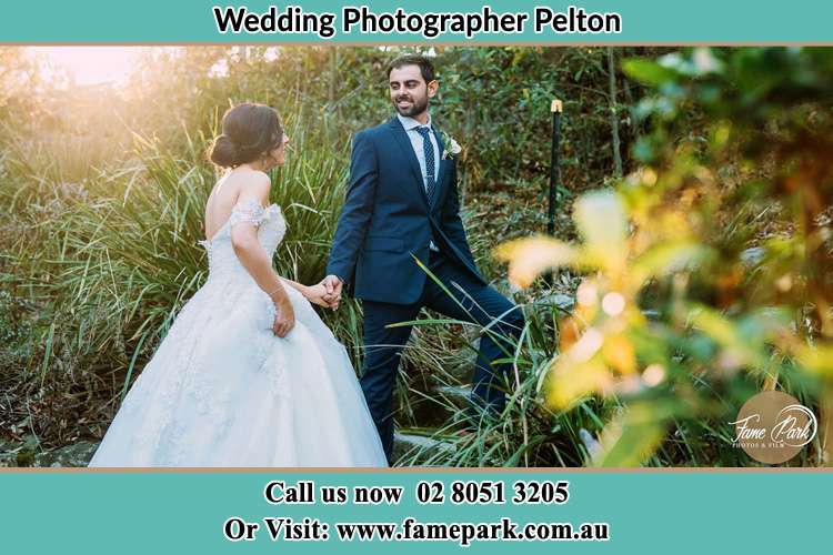 Photo of the Bride and the Groom going up hill Pelton NSW 2325