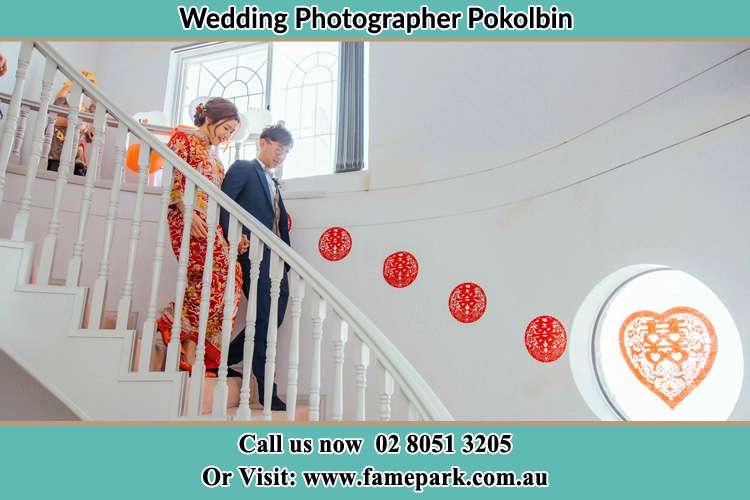 Photo of the Bride and the Groom going down the stair Pokolbin NSW 2320